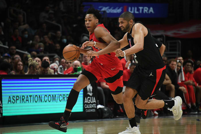 Toronto Raptors forward Scottie Barnes (4) moves the ball against Los Angeles Clippers forward Nicolas Batum (33) during the second half at Crypto.com Arena